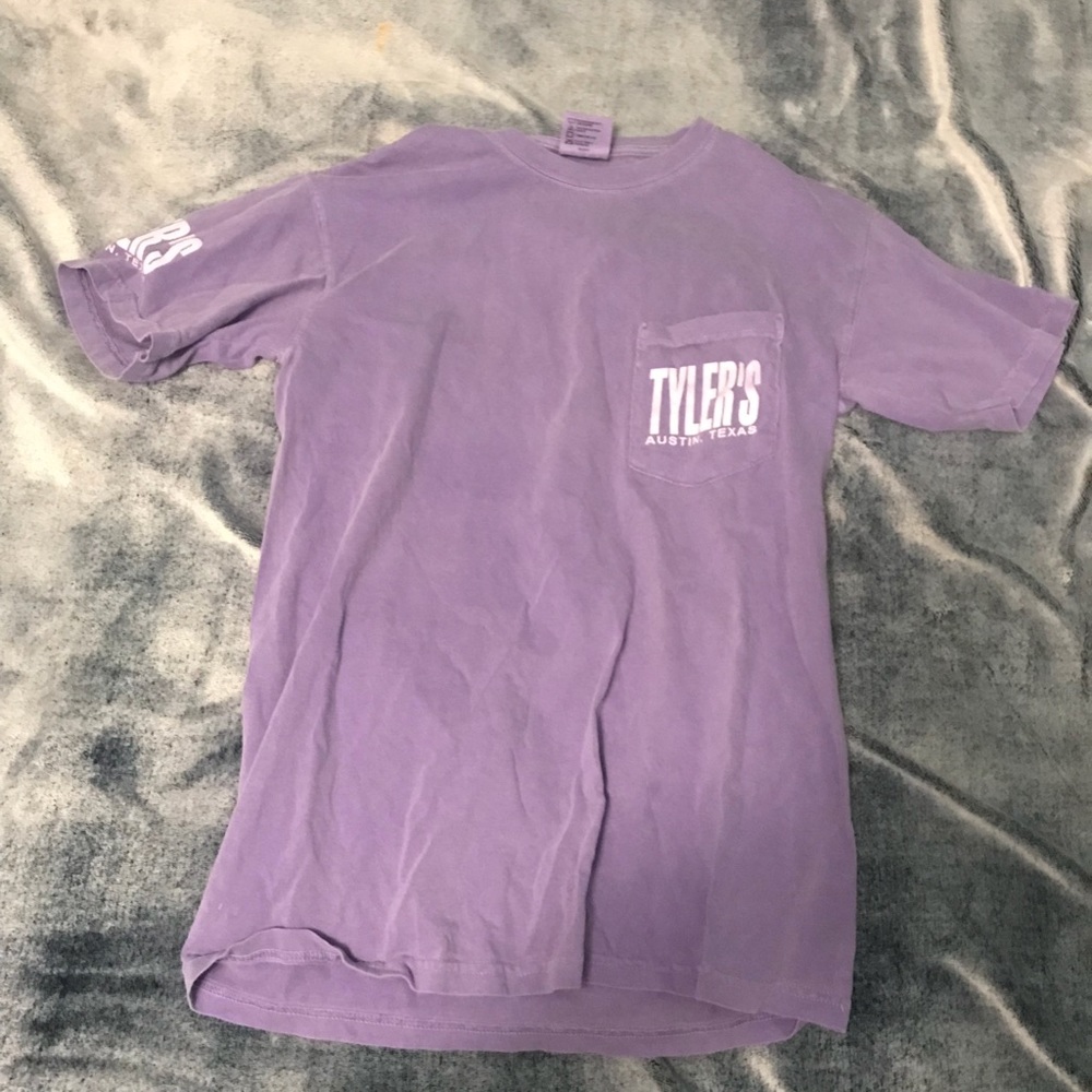 Purple T-shirt.